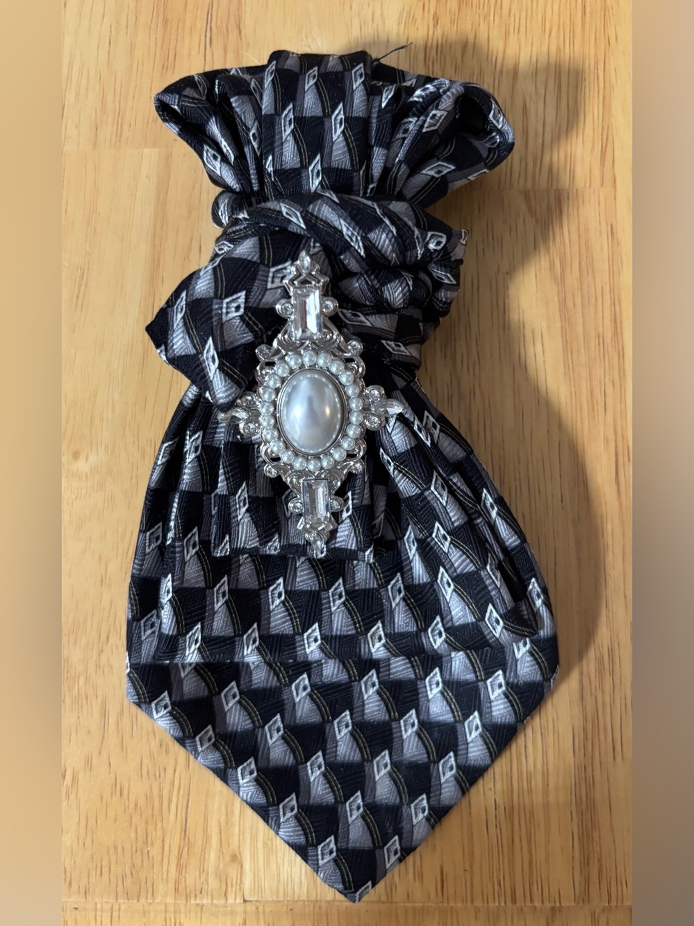 Black and Gray Patterned Necktie Necklace with Ornate Silver Brooch